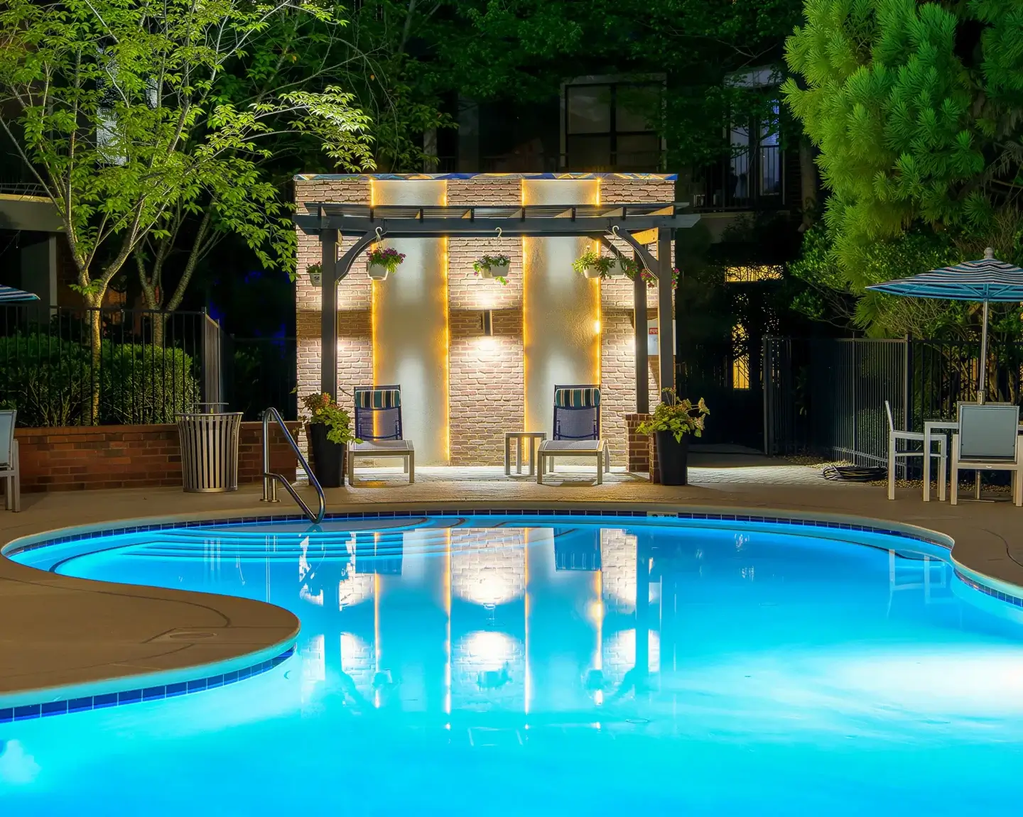 Swimming pool at Perimeter Gardens at Georgetown illuminated at dusk.